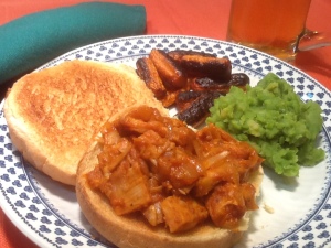 BBQ "pork" sandwich with roasted carrots,  mushy peas, and a nice cool beer.